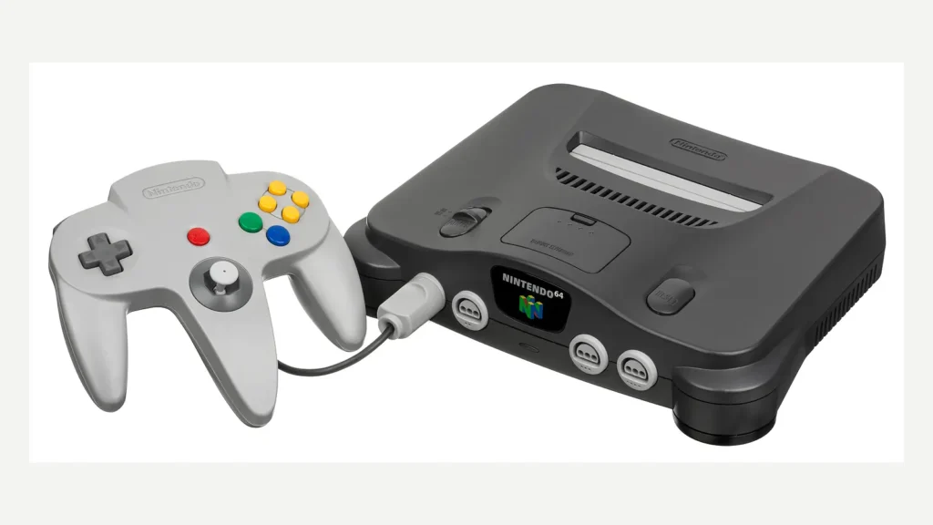 A black Nintendo 64 console and gray controller on a light background