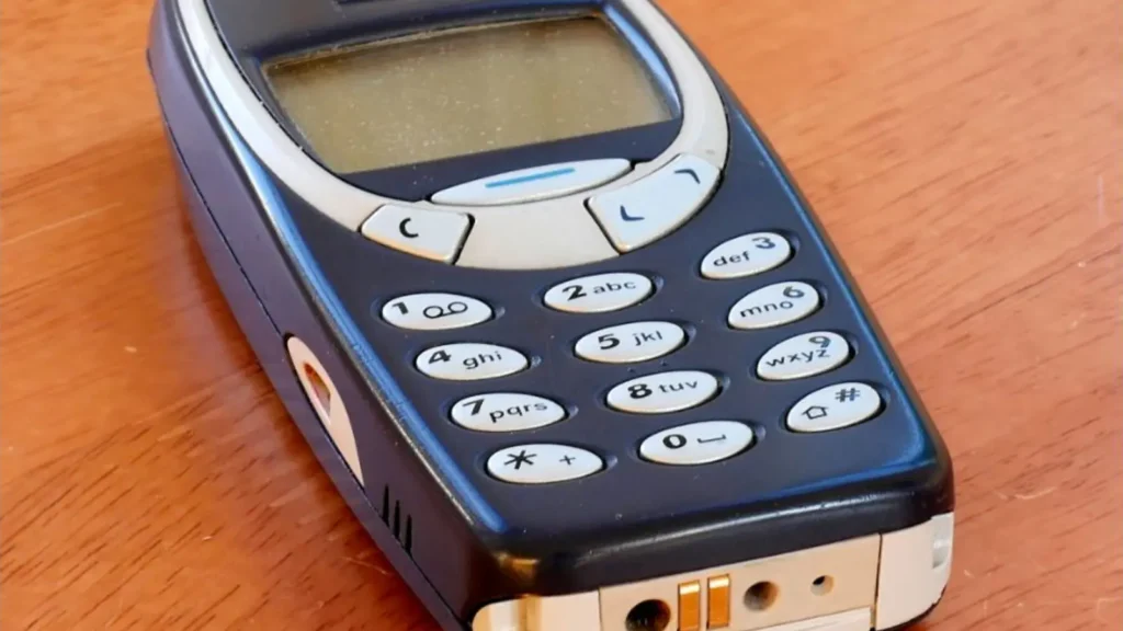 The keypad and curved blue case of an original Nokia 3310 phone